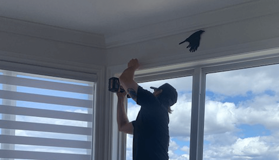 Man drilling window installation.